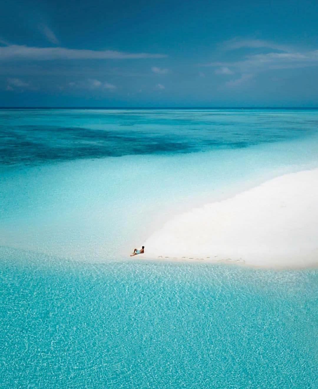 Aerial view of a turquoise Palawan lagoon framed by limestone cliffs
